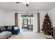 Bright living room featuring sliding glass doors to the patio at 3830 Vignoble Ln, Brandon, FL 33511