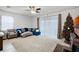 Spacious living room with blue sectional sofa and Christmas tree at 3830 Vignoble Ln, Brandon, FL 33511