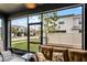 Relaxing screened porch with seating and backyard views at 3830 Vignoble Ln, Brandon, FL 33511
