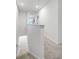Upstairs hallway with carpeted floors and access to bedrooms at 3830 Vignoble Ln, Brandon, FL 33511