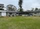 Large backyard with shed, patio and seating area, perfect for outdoor gatherings at 442 Country Club Dr, Oldsmar, FL 34677