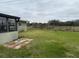 Expansive backyard with lush green grass and secure black metal fencing, perfect for outdoor activities at 442 Country Club Dr, Oldsmar, FL 34677