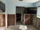 Bathroom with a large mirror, shower, and bare walls awaiting renovation at 442 Country Club Dr, Oldsmar, FL 34677