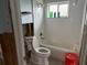 This bathroom boasts modern white subway tiles, a shower head, and a toilet, ready for renovation at 442 Country Club Dr, Oldsmar, FL 34677