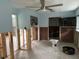 Bedroom awaiting renovation, featuring bare walls, TV, and a glimpse into an attached closet and bathroom at 442 Country Club Dr, Oldsmar, FL 34677