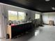 Spacious garage with sink, cabinets, and natural light, offering versatile space for projects and storage at 442 Country Club Dr, Oldsmar, FL 34677