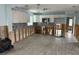 Bright kitchen with white cabinets, stainless steel appliances, and open layout awaiting renovation at 442 Country Club Dr, Oldsmar, FL 34677