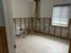 This living room features exposed studs and wiring, offering a blank canvas for remodeling at 442 Country Club Dr, Oldsmar, FL 34677