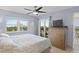 King-size bed, dresser, and balcony access at 4510 Gulf Blvd # 408, St Pete Beach, FL 33706