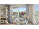 Ocean view dining area with glass table and wicker chairs at 4510 Gulf Blvd # 408, St Pete Beach, FL 33706