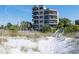 Building exterior, beach access, and dunes at 4510 Gulf Blvd # 408, St Pete Beach, FL 33706