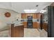 Modern kitchen with granite countertops and black appliances at 4510 Gulf Blvd # 408, St Pete Beach, FL 33706