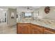Kitchen with granite countertops and wood cabinets at 4510 Gulf Blvd # 408, St Pete Beach, FL 33706