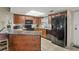 Kitchen with granite countertop and black appliances at 4510 Gulf Blvd # 408, St Pete Beach, FL 33706