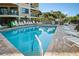 Resort-style pool with plenty of lounge chairs for relaxation at 4510 Gulf Blvd # 408, St Pete Beach, FL 33706
