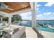 Covered patio with comfortable seating and water views at 477 20Th Ave, Indian Rocks Beach, FL 33785