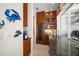 Well-equipped kitchen features wood cabinetry, wine cooler, and granite countertops at 477 20Th Ave, Indian Rocks Beach, FL 33785