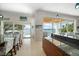 Kitchen with granite countertops, modern cabinetry, and breakfast bar at 477 20Th Ave, Indian Rocks Beach, FL 33785