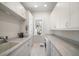 Laundry room with washer, dryer, and built-in cabinets at 477 20Th Ave, Indian Rocks Beach, FL 33785