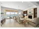 Spacious living room with fireplace, water views, and ample seating at 477 20Th Ave, Indian Rocks Beach, FL 33785