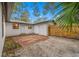 Brick patio, detached garage, and a fenced backyard at 505 Jefferson S Ave, Oldsmar, FL 34677