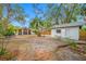 Large backyard with detached garage, fire pit and patio at 505 Jefferson S Ave, Oldsmar, FL 34677