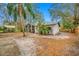 Screened porch, large backyard, mature trees, and shed at 505 Jefferson S Ave, Oldsmar, FL 34677