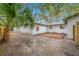 Small patio and a spacious backyard with a wooden fence at 505 Jefferson S Ave, Oldsmar, FL 34677