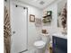 Updated bathroom with navy vanity and modern fixtures at 505 Jefferson S Ave, Oldsmar, FL 34677