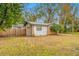 One car garage with a brick facade and a small patio at 505 Jefferson S Ave, Oldsmar, FL 34677