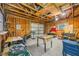 Unfinished garage interior with workbench and storage at 505 Jefferson S Ave, Oldsmar, FL 34677
