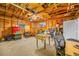 Unfinished garage with storage, workbench and chairs at 505 Jefferson S Ave, Oldsmar, FL 34677