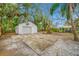 Detached garage with basketball court and fire pit at 505 Jefferson S Ave, Oldsmar, FL 34677