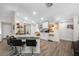 Updated kitchen with white shaker cabinets, granite countertops and breakfast bar at 505 Jefferson S Ave, Oldsmar, FL 34677