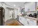 Modern kitchen with white cabinets, granite countertops, and ample counter space at 505 Jefferson S Ave, Oldsmar, FL 34677