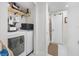 Clean laundry room, washer, dryer and extra shelving at 505 Jefferson S Ave, Oldsmar, FL 34677