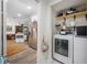 Convenient laundry room with washer, dryer, and shelving at 505 Jefferson S Ave, Oldsmar, FL 34677