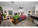 Open concept living room showcasing hardwood floors and ample natural light at 505 Jefferson S Ave, Oldsmar, FL 34677