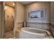 Relax in this spa-like bathroom, featuring a soaking tub and walk-in shower at 530 S Gulfview Blvd # 205, Clearwater, FL 33767