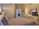 Spacious bedroom with a dresser and ensuite bathroom access at 530 S Gulfview Blvd # 205, Clearwater, FL 33767