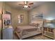 Comfortable guest bedroom with a queen-size bed and wood-look floors at 530 S Gulfview Blvd # 205, Clearwater, FL 33767