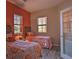 Bright twin bedroom with colorful bedding and large windows at 530 S Gulfview Blvd # 205, Clearwater, FL 33767