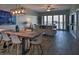 Open dining area with a live edge table and modern lighting at 530 S Gulfview Blvd # 205, Clearwater, FL 33767