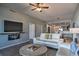 Living room features a large TV, fireplace, and comfortable seating at 530 S Gulfview Blvd # 205, Clearwater, FL 33767