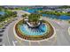 Aerial view of community entrance with fountain and landscaping at 5322 Windy Grove Dr, Wimauma, FL 33598