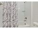 Clean bathroom with a bathtub, shower, and marble shower curtain at 5322 Windy Grove Dr, Wimauma, FL 33598