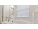 Bathroom with soaking tub and white tile at 5322 Windy Grove Dr, Wimauma, FL 33598