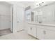 Bathroom with vanity, walk-in closet and tile flooring at 5322 Windy Grove Dr, Wimauma, FL 33598