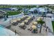 Beach entry pool with cabanas and lounge chairs at 5322 Windy Grove Dr, Wimauma, FL 33598