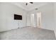 Spacious bedroom with carpeted floor and access to other rooms at 5322 Windy Grove Dr, Wimauma, FL 33598